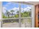 Scenic window view showcasing the water, lush greenery, palm trees, and the city skyline in the distance at 741 Mainsail Dr, Tampa, FL 33602