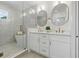 Modern bathroom featuring double vanity, soaking tub, glass shower, and stylish fixtures at 791 44Th N Ave, St Petersburg, FL 33703