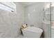 Luxurious bathroom with freestanding tub, elegant tile work, and modern gold fixtures at 791 44Th N Ave, St Petersburg, FL 33703