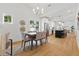 Spacious dining area open to a modern kitchen with stainless steel appliances and an island with seating at 791 44Th N Ave, St Petersburg, FL 33703