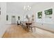 Bright dining room featuring a modern chandelier and dining set with large windows at 791 44Th N Ave, St Petersburg, FL 33703