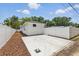 Long concrete driveway and mulch beds with a well-maintained fence and backyard at 791 44Th N Ave, St Petersburg, FL 33703