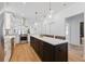 Gourmet kitchen with a center island, bar seating, and stainless steel appliances at 791 44Th N Ave, St Petersburg, FL 33703