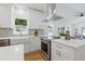 A stunning kitchen features stainless appliances, white cabinetry, and stylish hardware at 791 44Th N Ave, St Petersburg, FL 33703