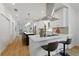 Bright kitchen featuring an island, stainless vent hood, and bar stool seating at 791 44Th N Ave, St Petersburg, FL 33703
