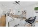 Stylish living room featuring wood floors, seating, and an open layout to the modern kitchen at 791 44Th N Ave, St Petersburg, FL 33703