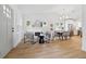 Bright open living space featuring light wood flooring, a modern fireplace, and a dining area for entertaining at 791 44Th N Ave, St Petersburg, FL 33703