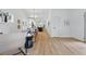 Open-concept living space with bright white walls, modern decor, and stylish light wood flooring throughout at 791 44Th N Ave, St Petersburg, FL 33703