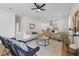 Bright living room with modern decor, ceiling fan, and an open flow into the kitchen at 791 44Th N Ave, St Petersburg, FL 33703