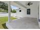 Open patio with a ceiling fan offers a relaxing outdoor space with a view of the lawn at 791 44Th N Ave, St Petersburg, FL 33703