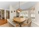 Cozy breakfast nook with a round table, surrounded by natural light from large windows at 8060 Timberlake Ave, Spring Hill, FL 34606