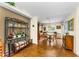 Open dining room with wooden table and chairs, plus stylish display shelving at 8060 Timberlake Ave, Spring Hill, FL 34606