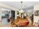 Bright dining area with wood furniture and sliding glass doors leading to a patio at 8060 Timberlake Ave, Spring Hill, FL 34606