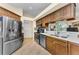 Traditional kitchen featuring stainless steel appliances and wood cabinetry at 8060 Timberlake Ave, Spring Hill, FL 34606