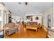 Cozy open-concept living room and dining area with wood floors at 8060 Timberlake Ave, Spring Hill, FL 34606
