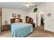 Neutral main bedroom with ample storage and a view into the en suite bathroom at 8060 Timberlake Ave, Spring Hill, FL 34606