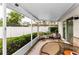 Relaxing screened patio featuring a dining table, chairs, and a view of the backyard at 8060 Timberlake Ave, Spring Hill, FL 34606