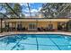 Spacious backyard featuring a pool, patio, and outdoor seating, perfect for entertaining and enjoying the Florida lifestyle at 8127 Siquita Ne Dr, St Petersburg, FL 33702