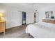 Bedroom featuring a mirrored closet and a view into the walk-in closet at 8127 Siquita Ne Dr, St Petersburg, FL 33702