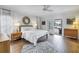 Bright bedroom with sliding glass doors to the patio and water views at 8127 Siquita Ne Dr, St Petersburg, FL 33702