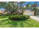 Charming home with a well-manicured lawn, mature trees, and a two-car garage at 8127 Siquita Ne Dr, St Petersburg, FL 33702