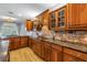 Detailed kitchen with custom wood cabinets, granite countertops, stainless steel appliances and lots of serving area at 8127 Siquita Ne Dr, St Petersburg, FL 33702