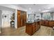 Gourmet kitchen boasts a large island, custom wood cabinets, stone counters, and modern stainless steel appliances at 8127 Siquita Ne Dr, St Petersburg, FL 33702