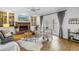 Living room with fireplace and built in cabinets and views of the pool at 8127 Siquita Ne Dr, St Petersburg, FL 33702