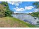 Scenic waterfront view showcasing lush landscaping and tranquil lake waters at 8127 Siquita Ne Dr, St Petersburg, FL 33702