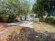 Wide shot of the home's backyard with patio and fire pit at 834 Grand Central St, Clearwater, FL 33756