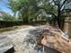 Wide shot of home's backyard with patio and fire pit at 834 Grand Central St, Clearwater, FL 33756