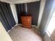 Bedroom featuring a wooden dresser and dark curtains at 834 Grand Central St, Clearwater, FL 33756