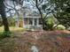 Charming home exterior with front porch and mature trees at 834 Grand Central St, Clearwater, FL 33756