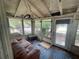 Bright sunroom with multiple windows, a sitting area, and plenty of natural light at 834 Grand Central St, Clearwater, FL 33756