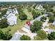 Aerial view of property with a golf course nearby, surrounded by lush greenery and other well-kept homes at 860 Maclaren N Dr # A, Palm Harbor, FL 34684