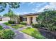 Charming home featuring well-maintained landscaping and a welcoming entrance with a tidy front yard at 860 Maclaren N Dr # A, Palm Harbor, FL 34684