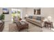 Cozy living room with a comfortable sofa, armchair, and a decorative coffee table at 860 Maclaren N Dr # A, Palm Harbor, FL 34684