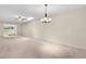 Bright living room with sliding glass doors and a ceiling fan for a comfortable ambiance at 860 Maclaren N Dr # A, Palm Harbor, FL 34684