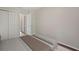 Simple bedroom with ample closet space, neutral walls, and a comfortable bench seat at 9831 83Rd Way, Seminole, FL 33777