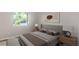 Inviting bedroom featuring a large window offering natural light and creating a comfortable living space at 9831 83Rd Way, Seminole, FL 33777