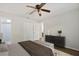 Serene bedroom with a ceiling fan, neutral walls, and minimalist decor offering a peaceful space at 9831 83Rd Way, Seminole, FL 33777