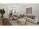 Bright living room with hardwood floors and stylish furniture, creating a cozy and inviting atmosphere at 9831 83Rd Way, Seminole, FL 33777
