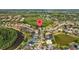 Aerial view of a residential neighborhood with lakes, mature trees, and beautiful homes at 10646 Cory Lake Dr, Tampa, FL 33647