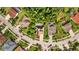 Aerial view of a neighborhood featuring well-manicured lawns, mature trees, and backyard swimming pools at 10646 Cory Lake Dr, Tampa, FL 33647