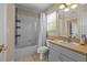 Full bathroom featuring a shower and tub combination with a single vanity at 10646 Cory Lake Dr, Tampa, FL 33647