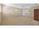 Neutral bedroom with three large windows and closet space at 10646 Cory Lake Dr, Tampa, FL 33647