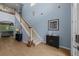 Inviting foyer with staircase and hardwood floors, leading to the living areas at 10646 Cory Lake Dr, Tampa, FL 33647