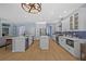 Spacious open kitchen with stainless steel appliances, island and stylish design at 10646 Cory Lake Dr, Tampa, FL 33647