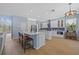 Bright, spacious kitchen featuring a center island with seating, stainless appliances, and custom backsplash at 10646 Cory Lake Dr, Tampa, FL 33647