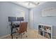 Office featuring a desk with two monitors, natural light, and a white board at 10646 Cory Lake Dr, Tampa, FL 33647